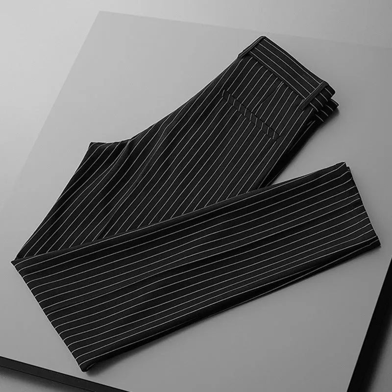 Men's loose-fitting striped casual trousers in black and white colours showing trousers and crop jeans styles