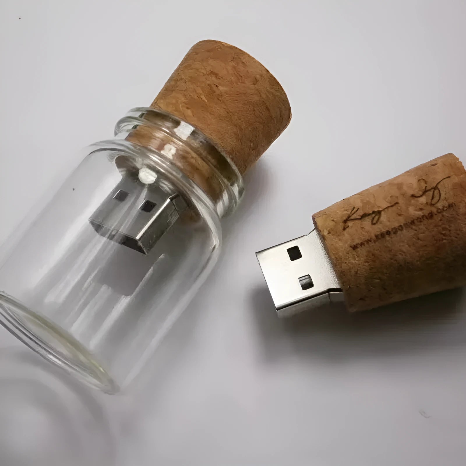 Transparent wooden wish drift bottle containing a USB flash drive on a white background.