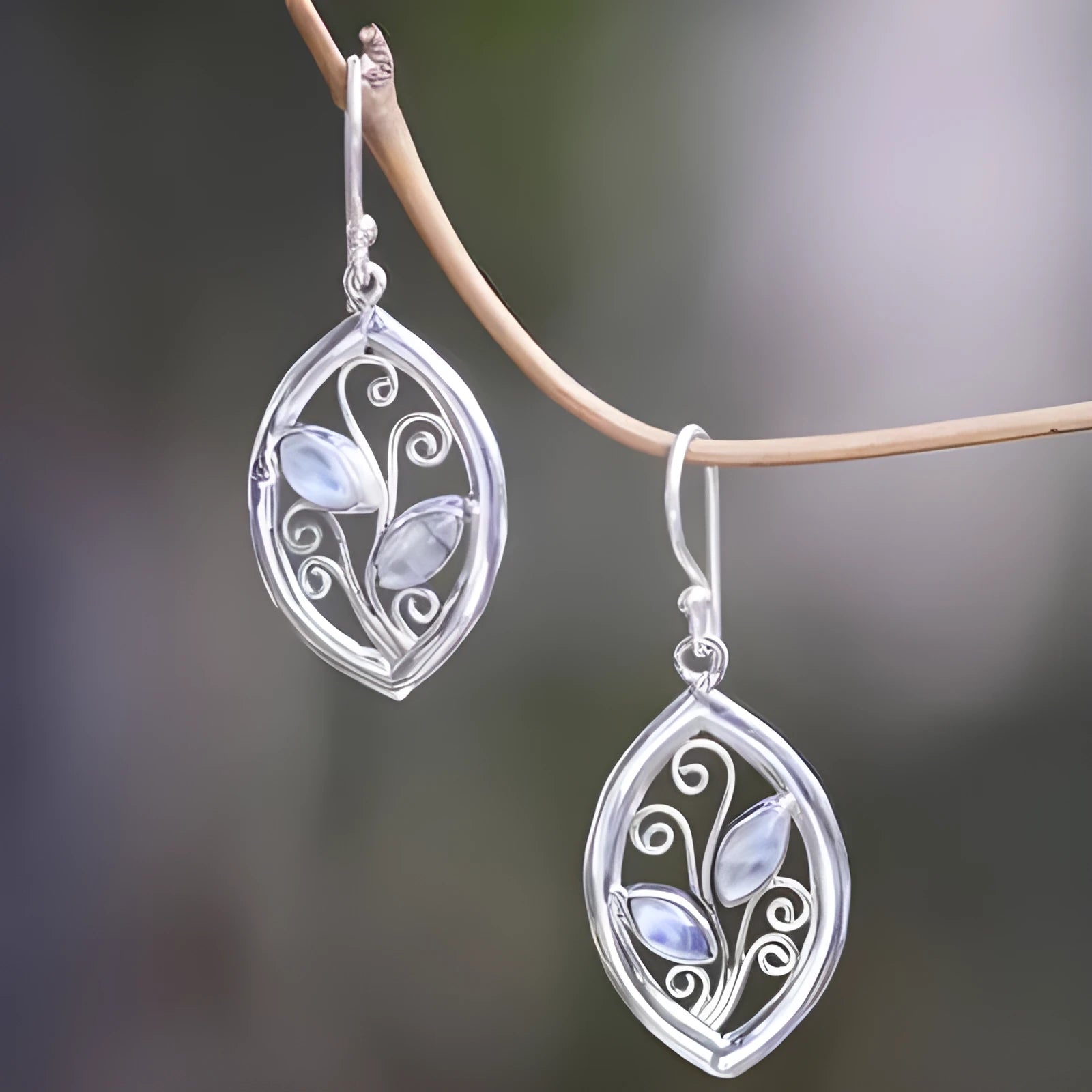 Silver leaf-shaped women's earrings with embedded colourful moonstone gemstones