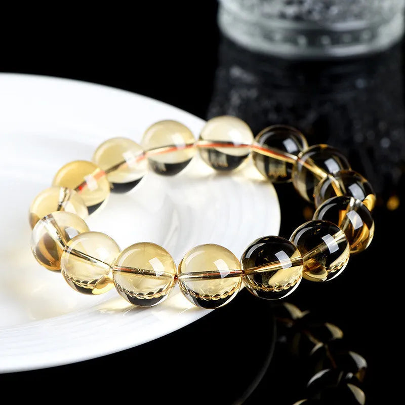 Natural citrine scattered beads ball bracelet showing polished stones on wrist.