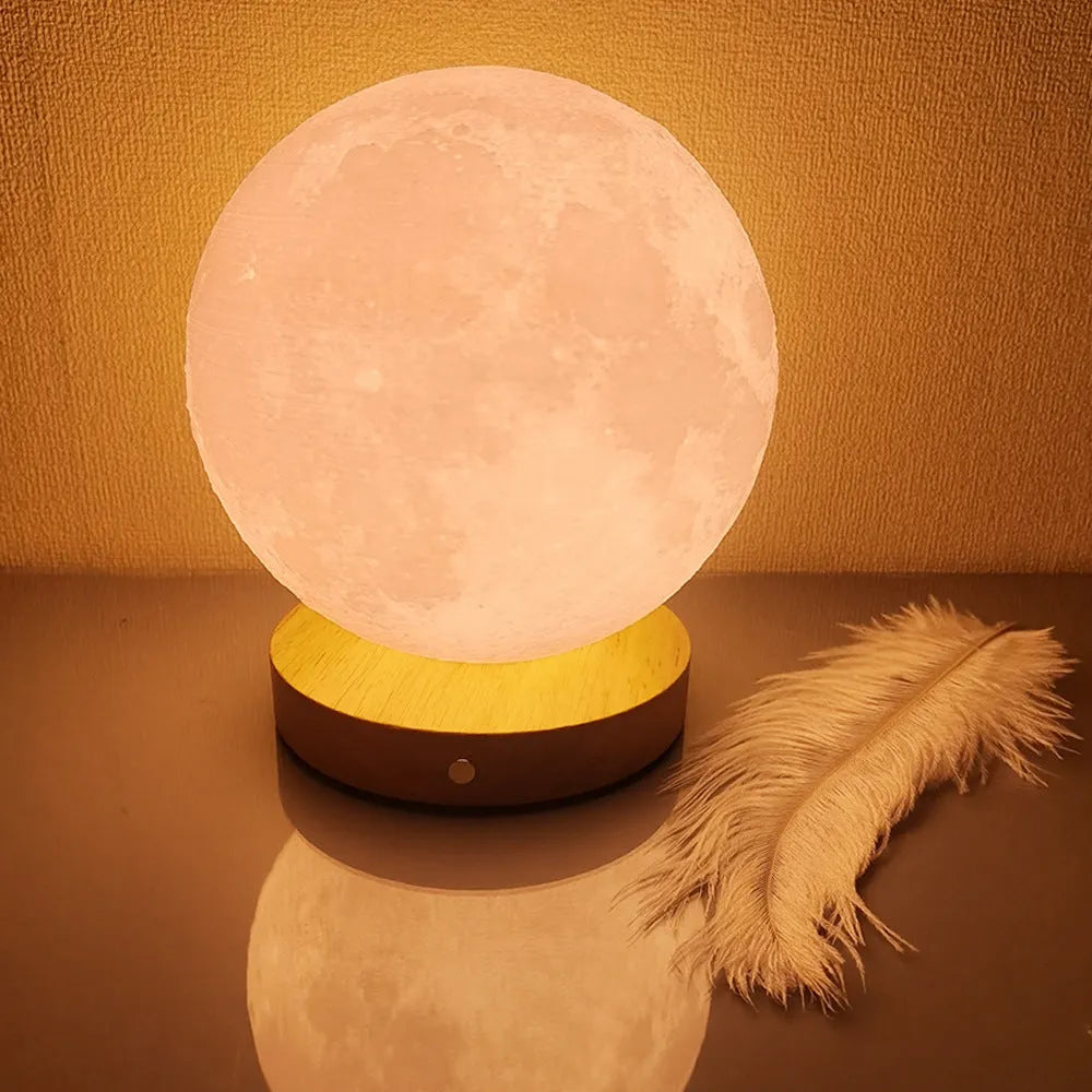 Rotating moon night lamp with wooden base showing three colour modes