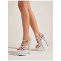 Women's black stiletto sandals with hollow-out buckle straps and a round toe.