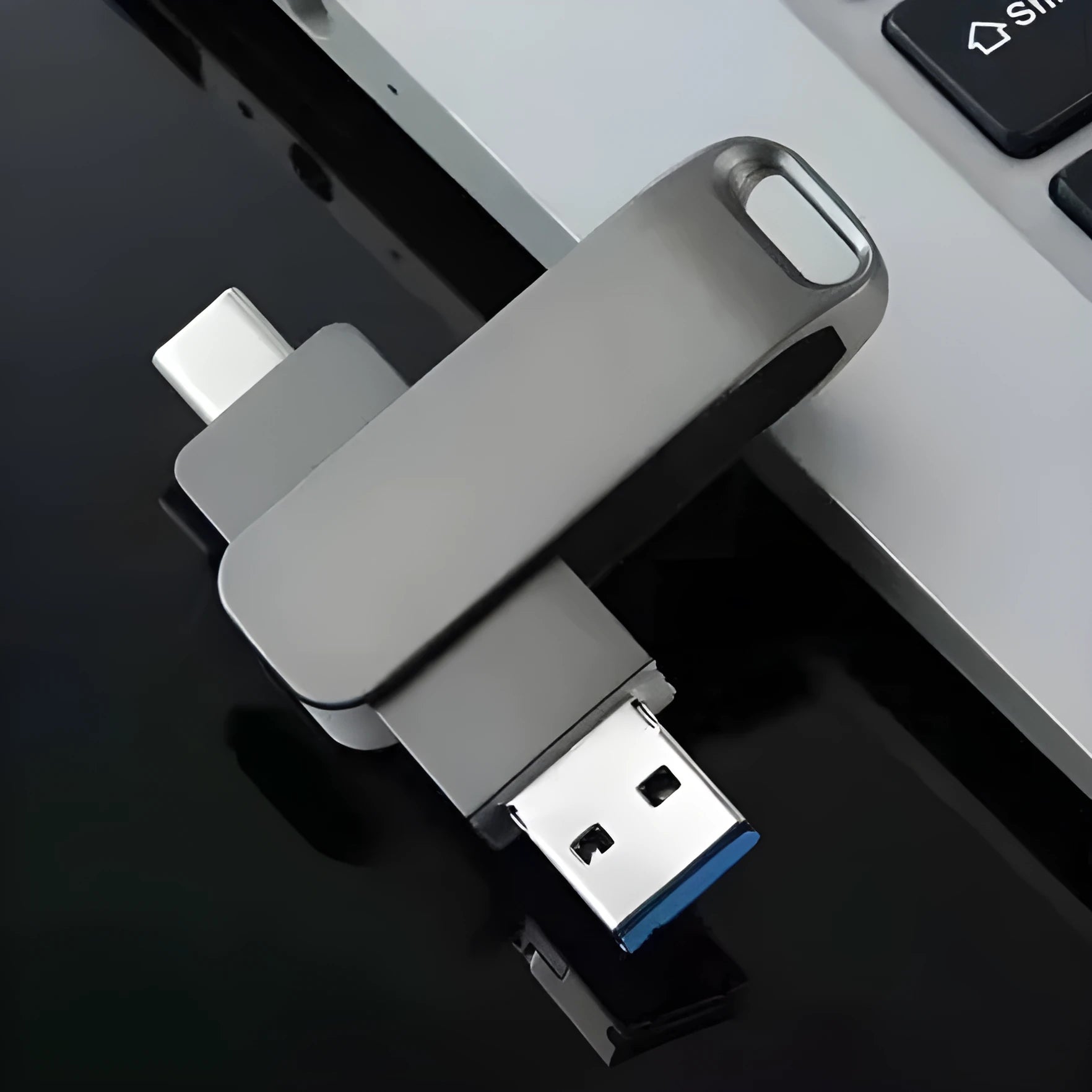 Silver rotating metal USB flash drive showing both USB and Type-C connectors