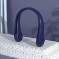 Blue portable bladeless neck fan hanging ergonomically, showing USB charging port and control button.