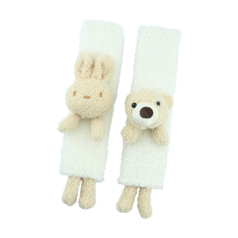 Plush lamb wool car seatbelt shoulder protector with cartoon rabbit and bear designs.