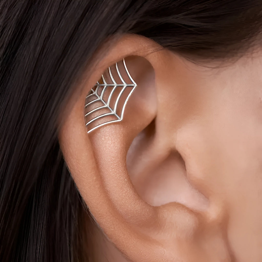 Geometric spider web stud earrings with electroplated gold finish and mesh patterning