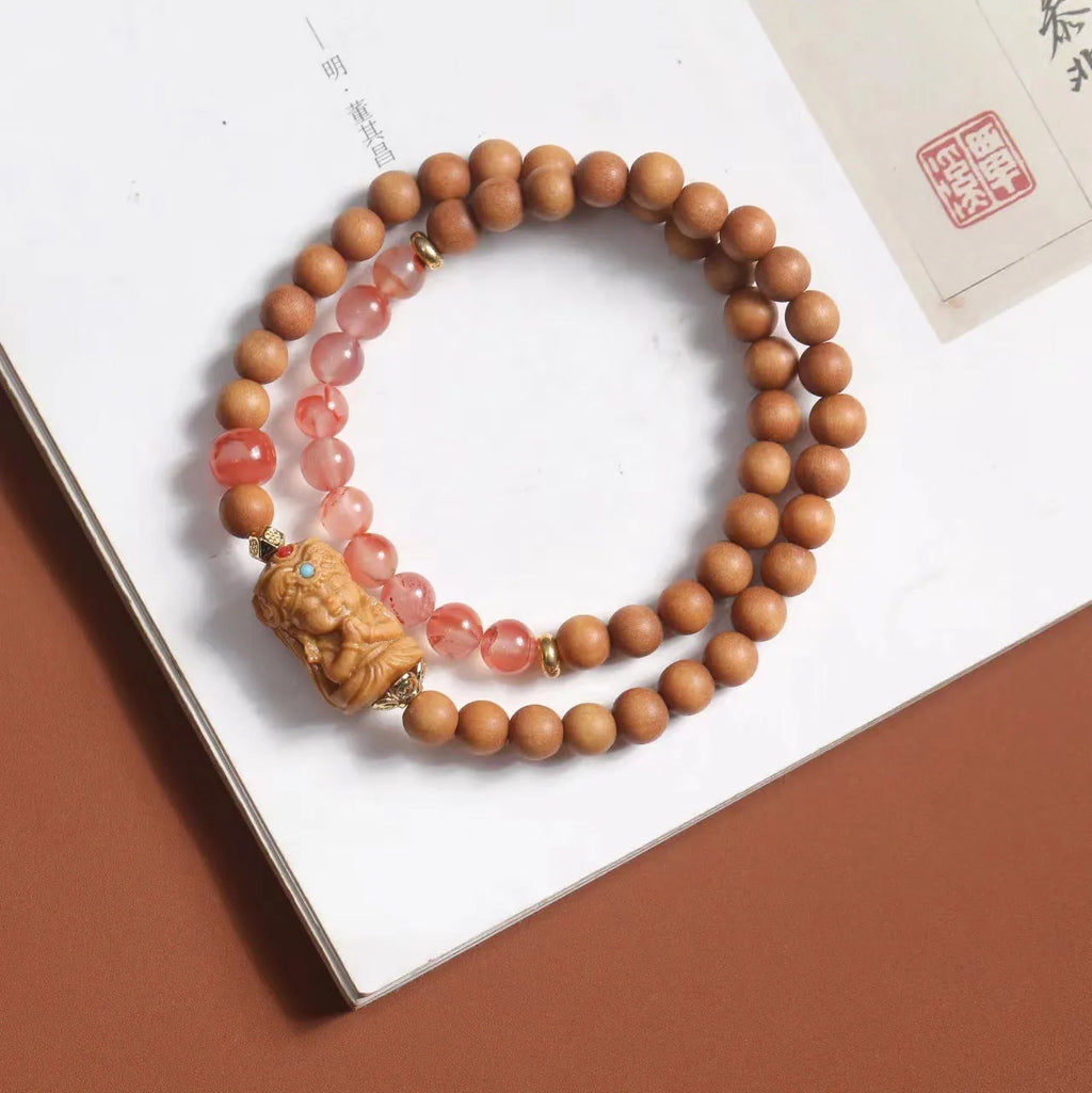 Brown wooden bracelet with sandalwood beads featuring South Red Zachilam and double circle design