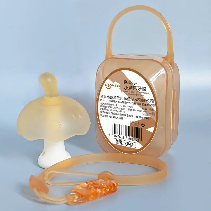 Small mushroom-shaped pink silicone gum charm in a transparent box with a delicate chain.