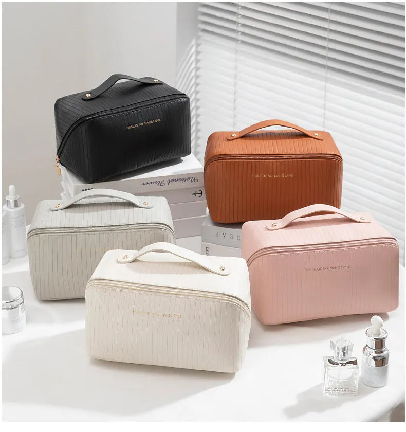 Vertical stripe pattern cubic makeup bag in PU material measuring 22.5cm wide