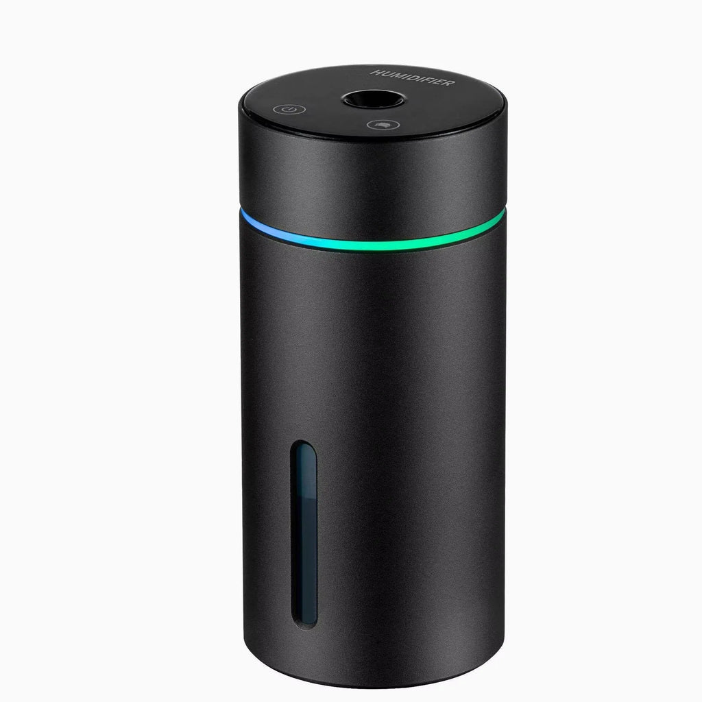 Black aluminium portable car humidifier and essential oil diffuser with night light on a desk