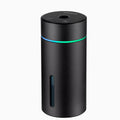 Black aluminium portable car humidifier and essential oil diffuser with night light on a desk