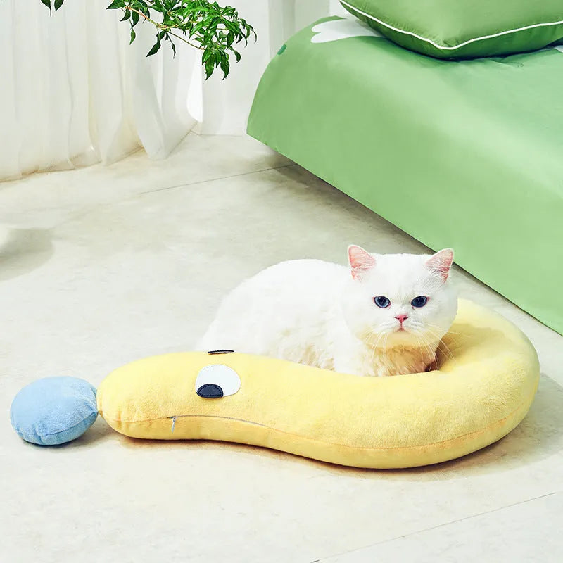 Blue rectangular dog pillow measuring 62 by 39 centimetres on a wooden floor.