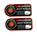 Pair of Tesla Sentry Mode warning stickers showing English text on PVC material