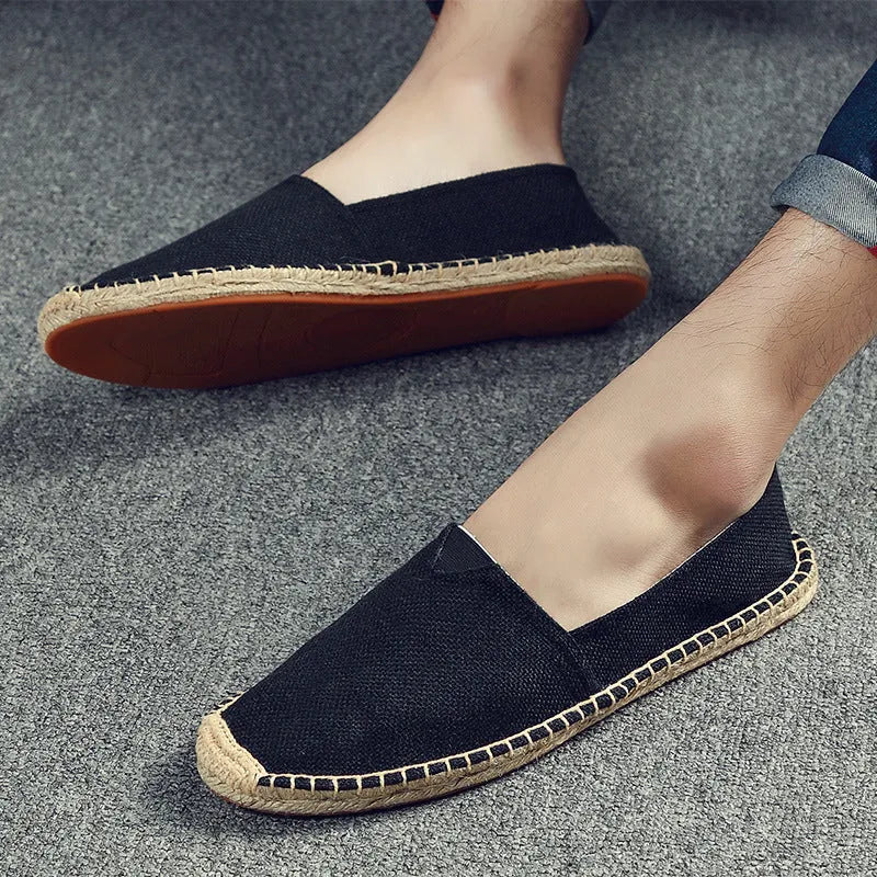 Men's solid colour canvas casual shoes with round toe in multiple size options.