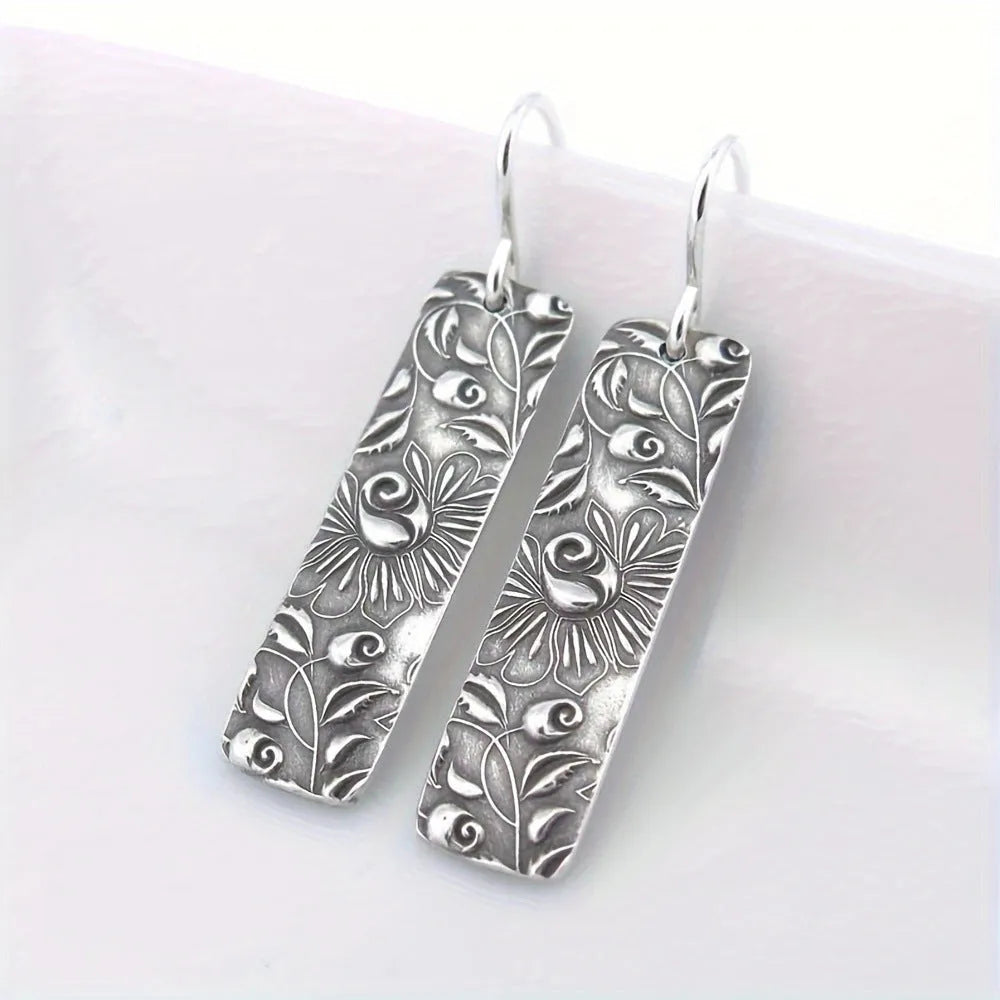 Silver geometric long earrings with carved vine design in retro style