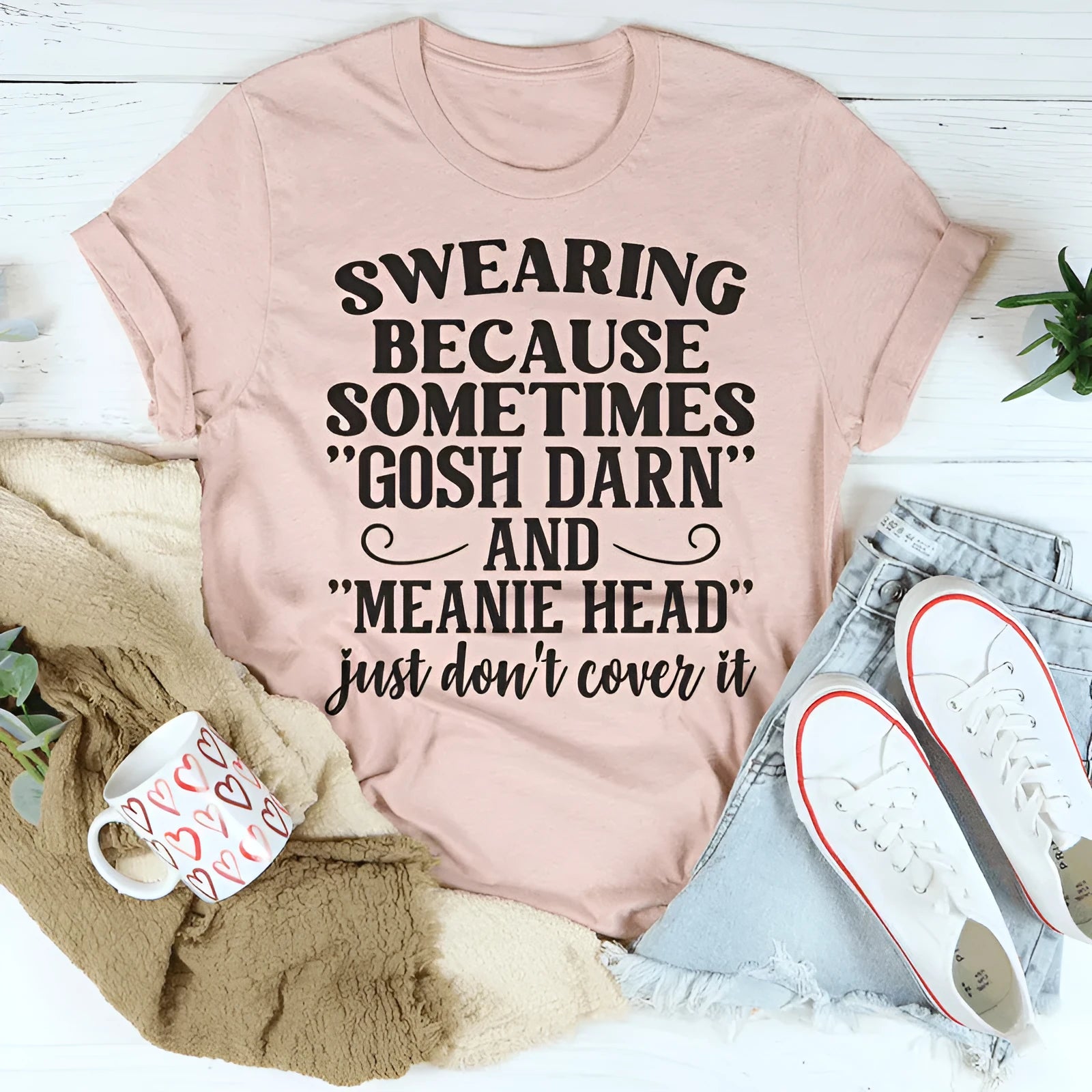 A pink couple's matching T-shirt with a printed design, short sleeves, and a straight casual cut.
