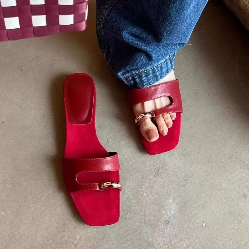 Plus size leather outdoor slippers with square toe in red, white, black, and silver on a rubber sole.