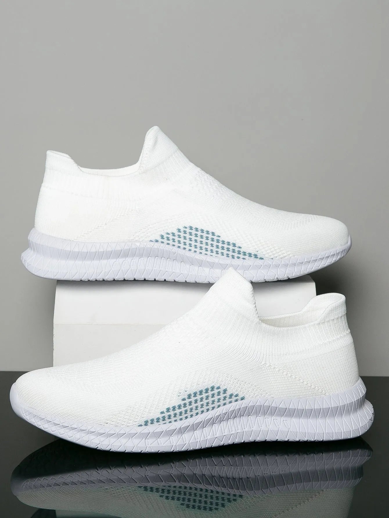 Men's white Popcorn Flyknit low-top casual sneaker on a solid background.