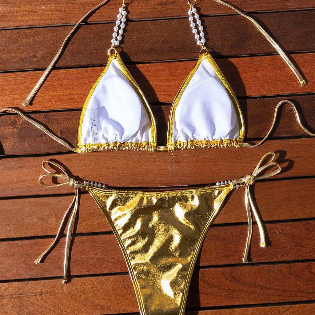 Gold halter bikini with lace-up front and pearl chain detail, brief cut swimsuit