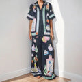 Black women's casual set with cartoon pattern featuring cardigan top and trousers