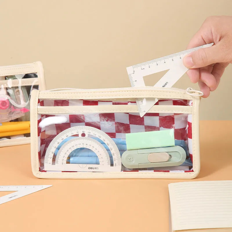 Transparent PVC pencil case with chessboard pattern, open to show large interior for pens.