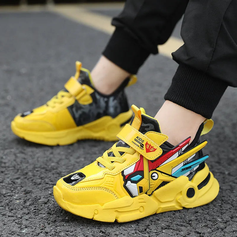 Boys yellow artificial leather sneakers with Velcro strap and cartoon pattern, on a rubber sole.