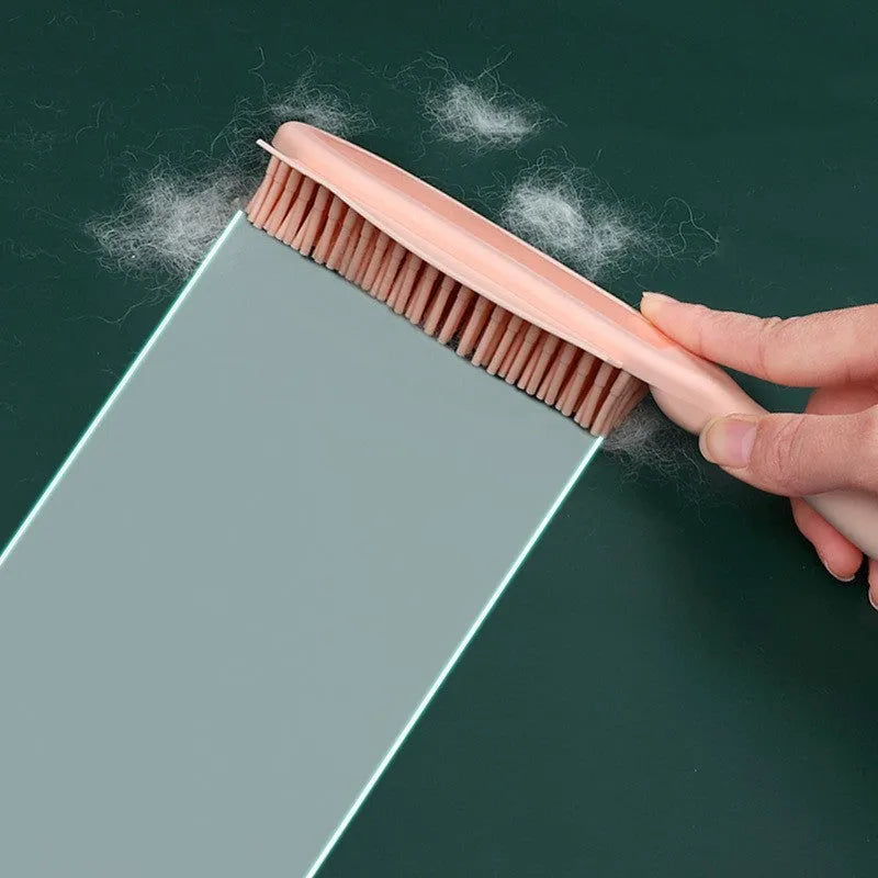 Green silicone pet brush with removable hair collector for grooming dogs, cats, and removing hair from clothes.