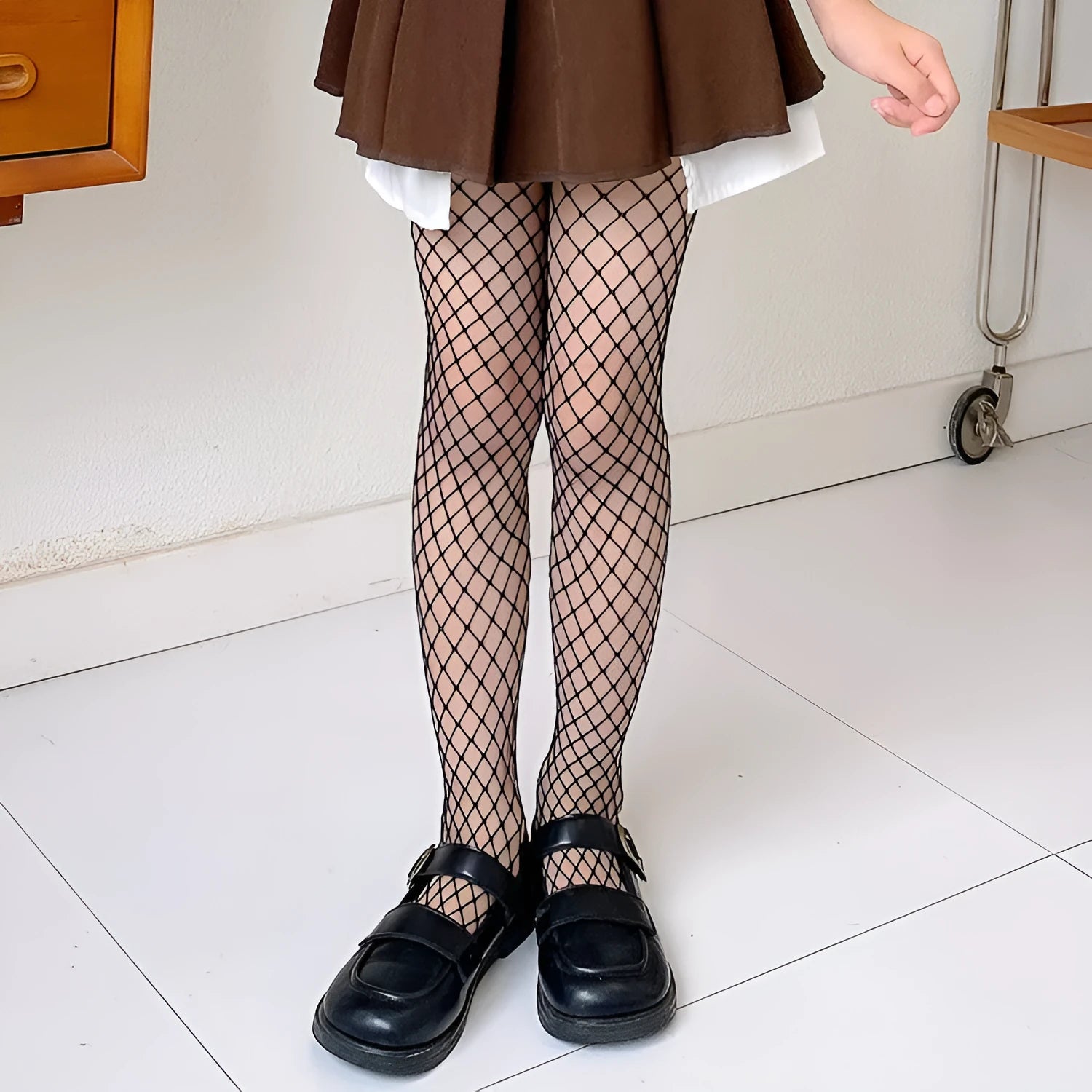 Women's mesh stockings showing large, medium, and small net patterns in black and white colours