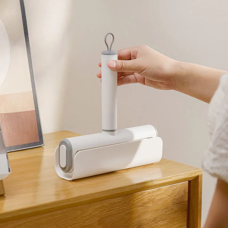 Lint remover roller with tearable paper stick for pet hair removal from floors