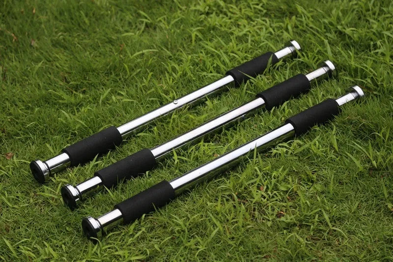 Steel adjustable indoor pull-up bar extended for door frame fitness training.