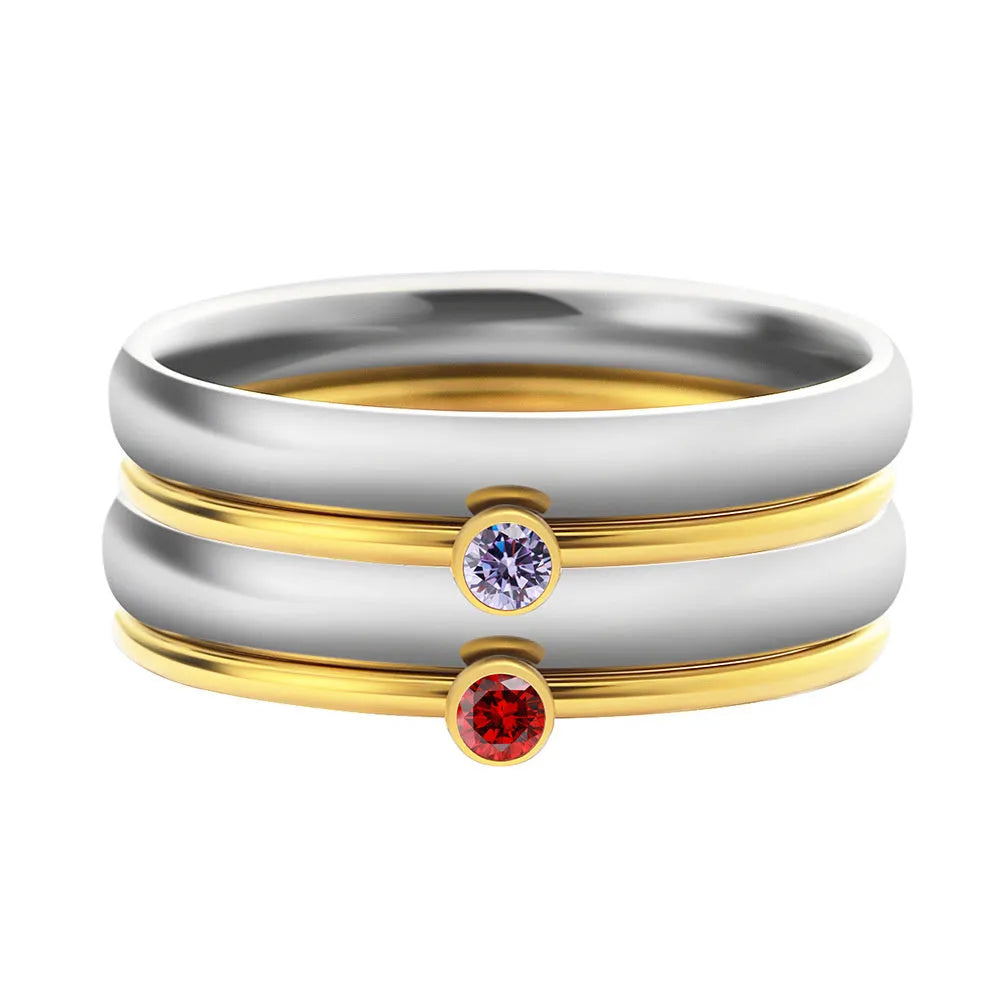 Geometric engraved titanium steel ring with December birthstone colour and electroplated gold handle.