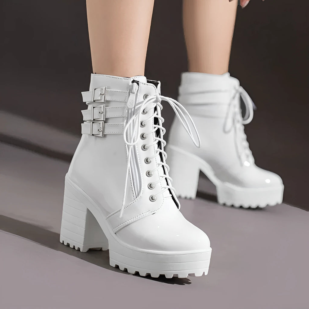 Women's black thick heel ankle boots with round toe and front lace-up on a waterproof platform.