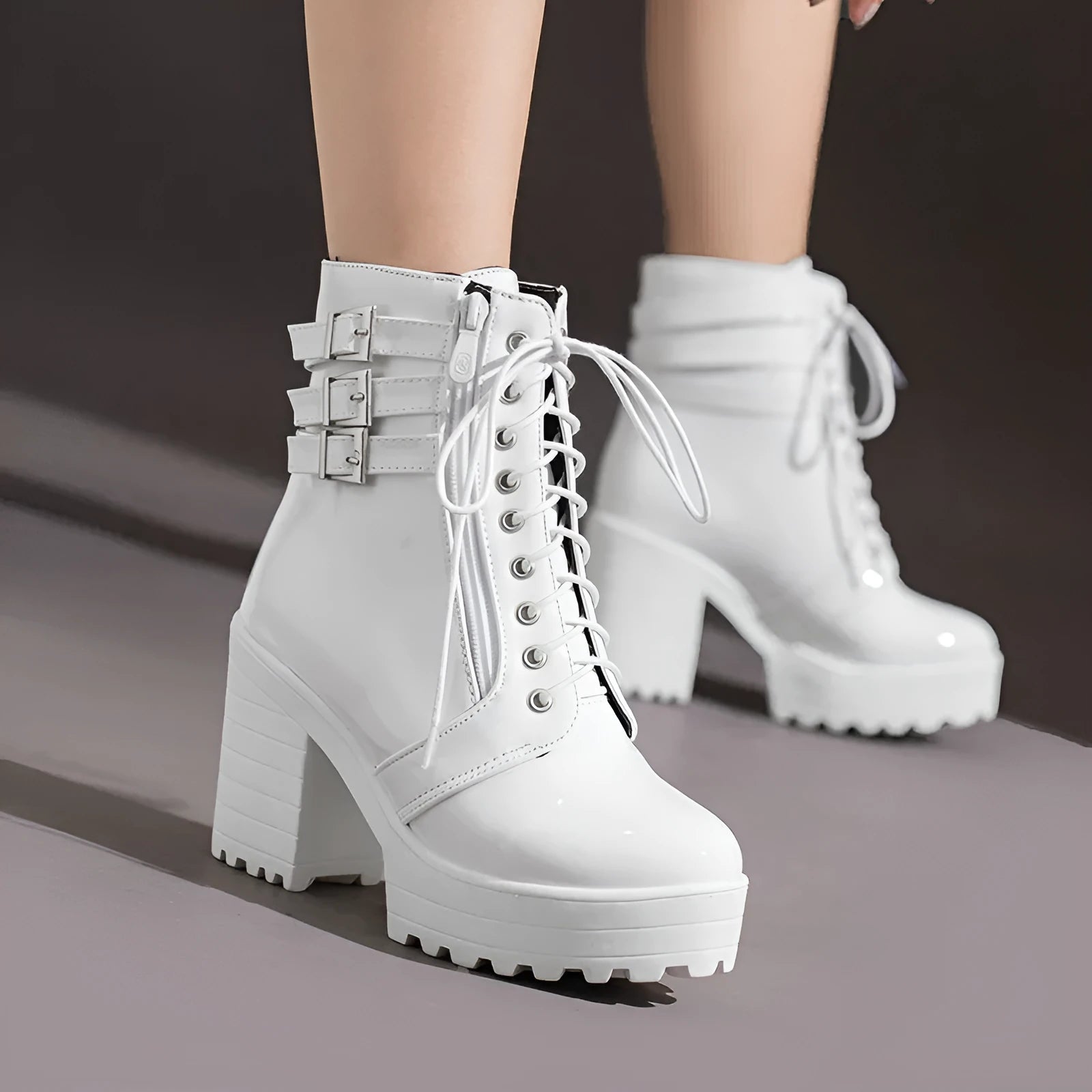 Women's black thick heel ankle boots with round toe and front lace-up on a waterproof platform.