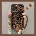 Brown leopard print silicone iPhone case showing the integrated lanyard loop on the corner.