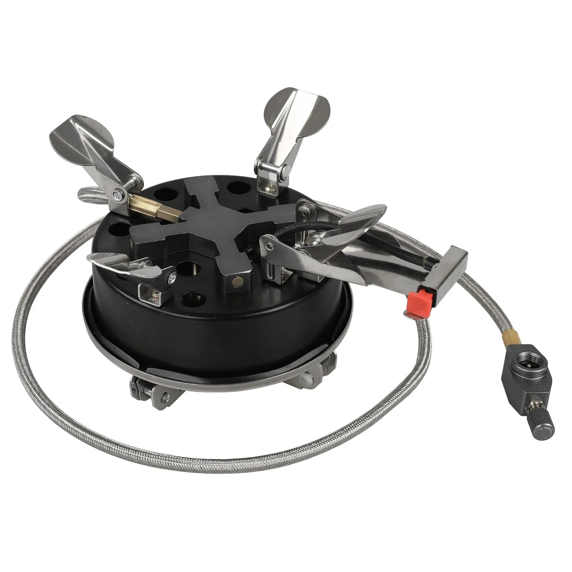 Silver portable split camping stove with foldable legs and a long black hose, on a grass background.