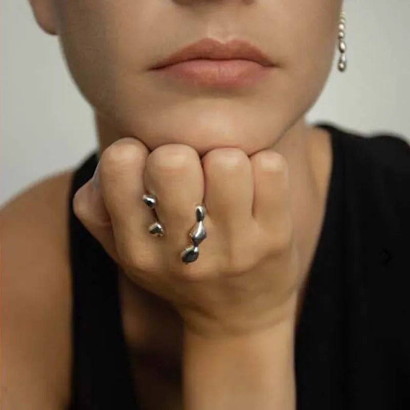 Brass spherical ring with circular design elements in gold or silver finish