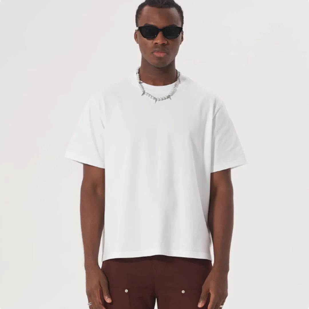 Pure cotton loose fit t-shirt on a hanger, shown in apricot colour.