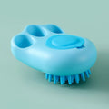 A blue cat claw-shaped pet bath brush for grooming and massaging dogs or cats during washing.