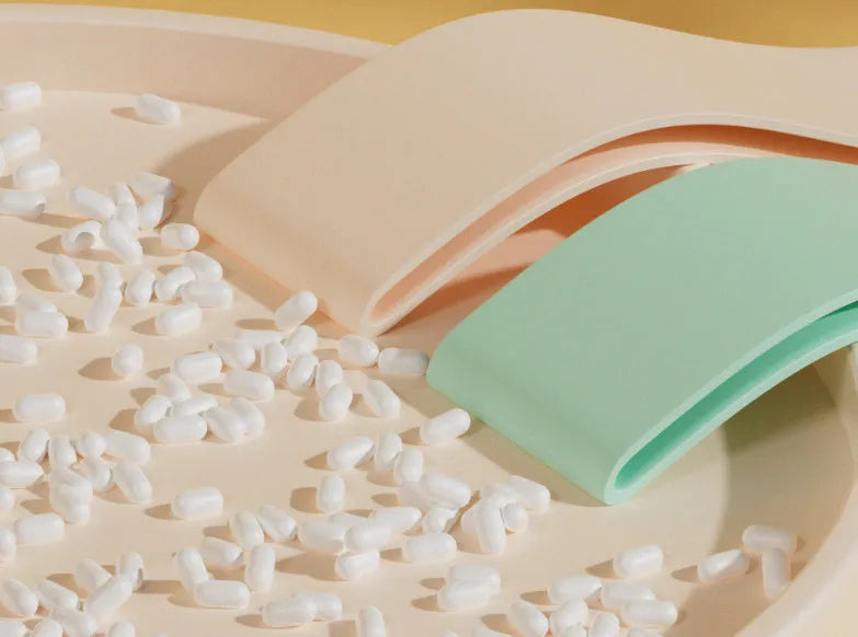 Four elastic resistance bands in green, beige, orange, and pink colours representing 30, 20, 15, and 10 lbs resistance levels