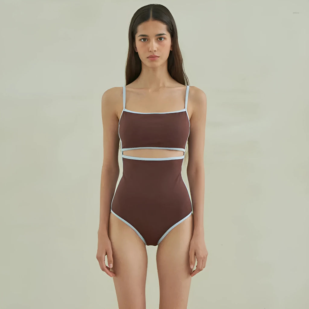 Brown women's one-piece swimsuit with a triangular style on a mannequin