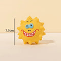 Four coloured natural latex squeaky dog balls with bumpy texture and cute faces