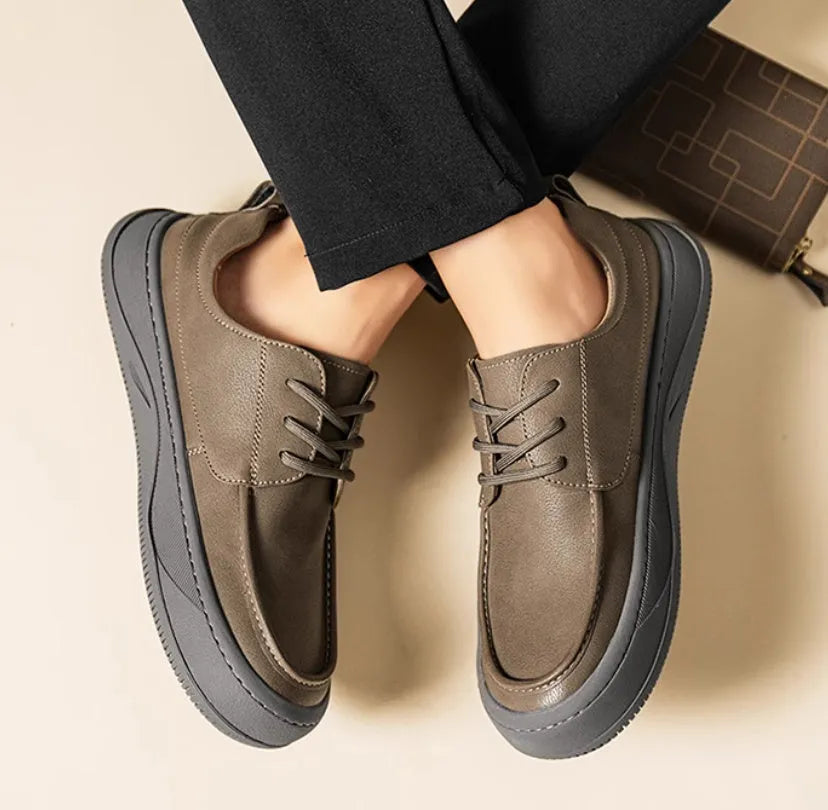 British retro style brown leather casual shoes with big toe design on a white background.