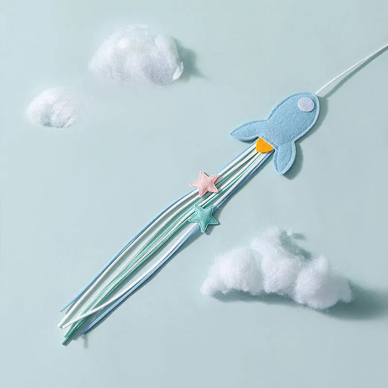 Blue rocket cat teaser toy with feathers on long pole for interactive play with kittens and cats