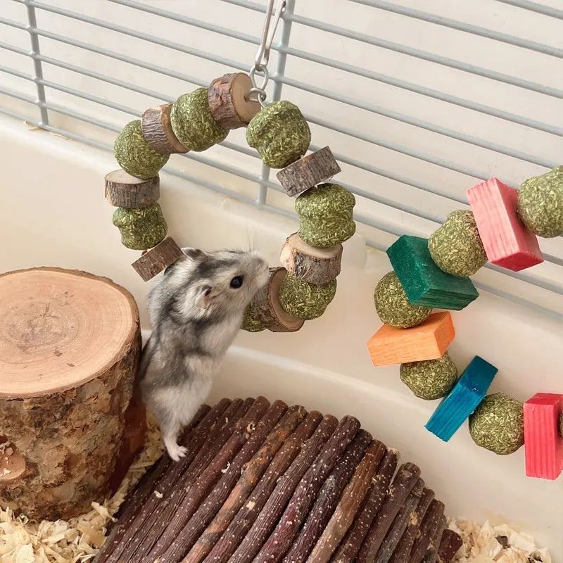 Hamster toy with applewood chew rod and woven straw ball ring for small pet enrichment