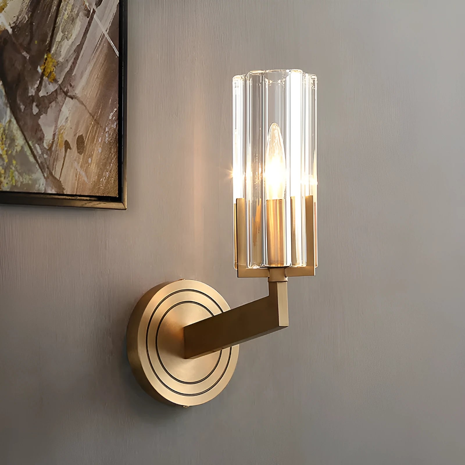 Modern minimalist copper wall lamp with single head on a plain wall.