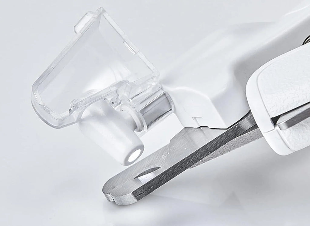White pet nail clipper with LED light, transparent anti-splash guard, and leather-like handle