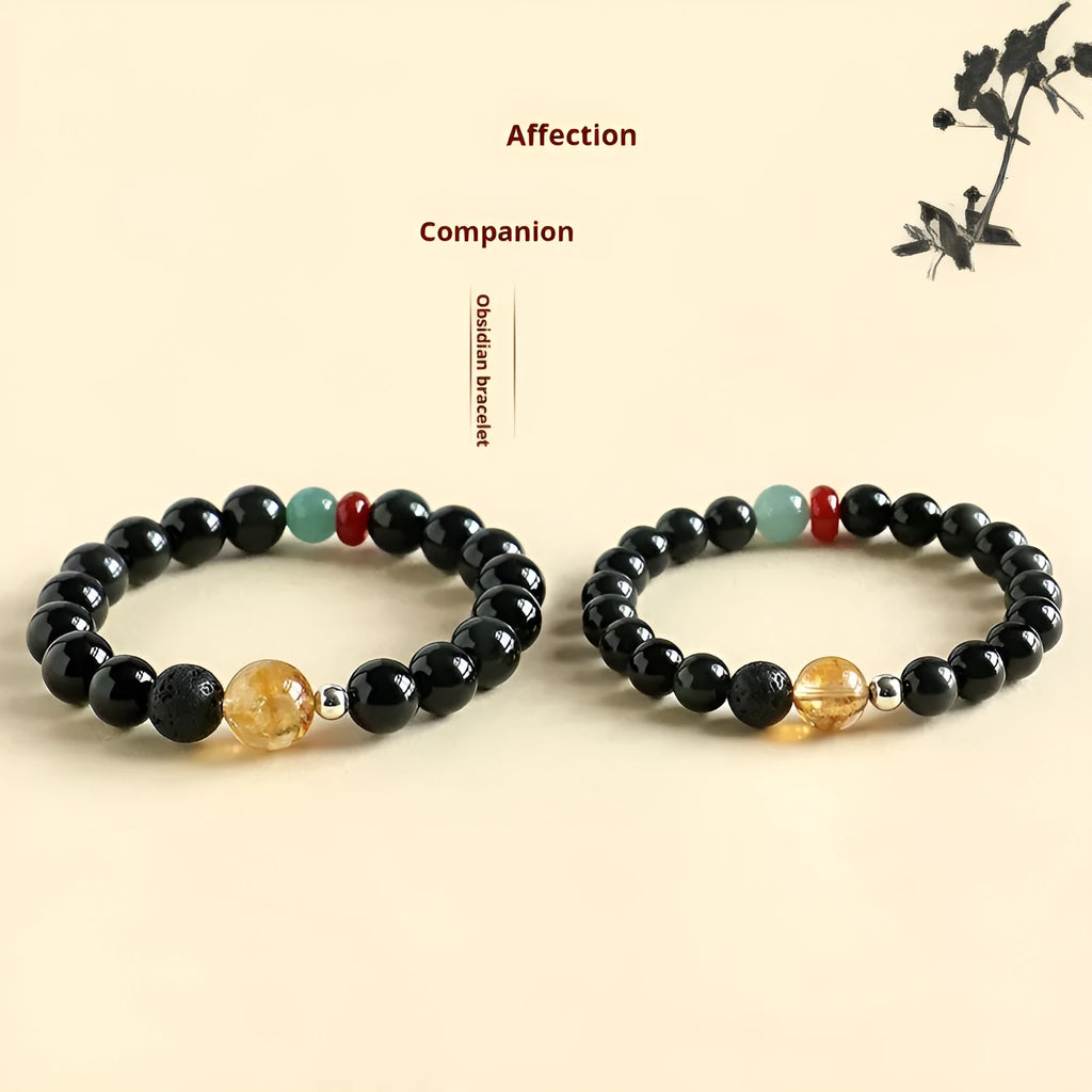 Chinese style obsidian yellow tower crystal and agate jade beaded bracelet shown in 8mm and 10mm bead sizes