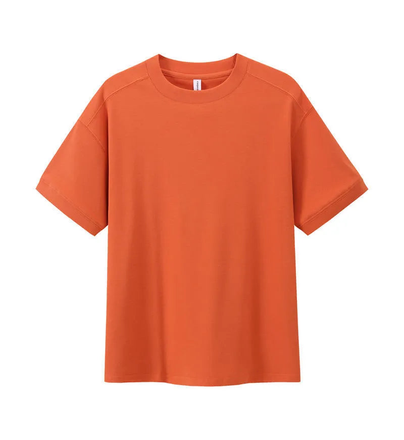 Men's loose-fit short-sleeved cotton pique t-shirt on a hanger, shown in a solid colour.