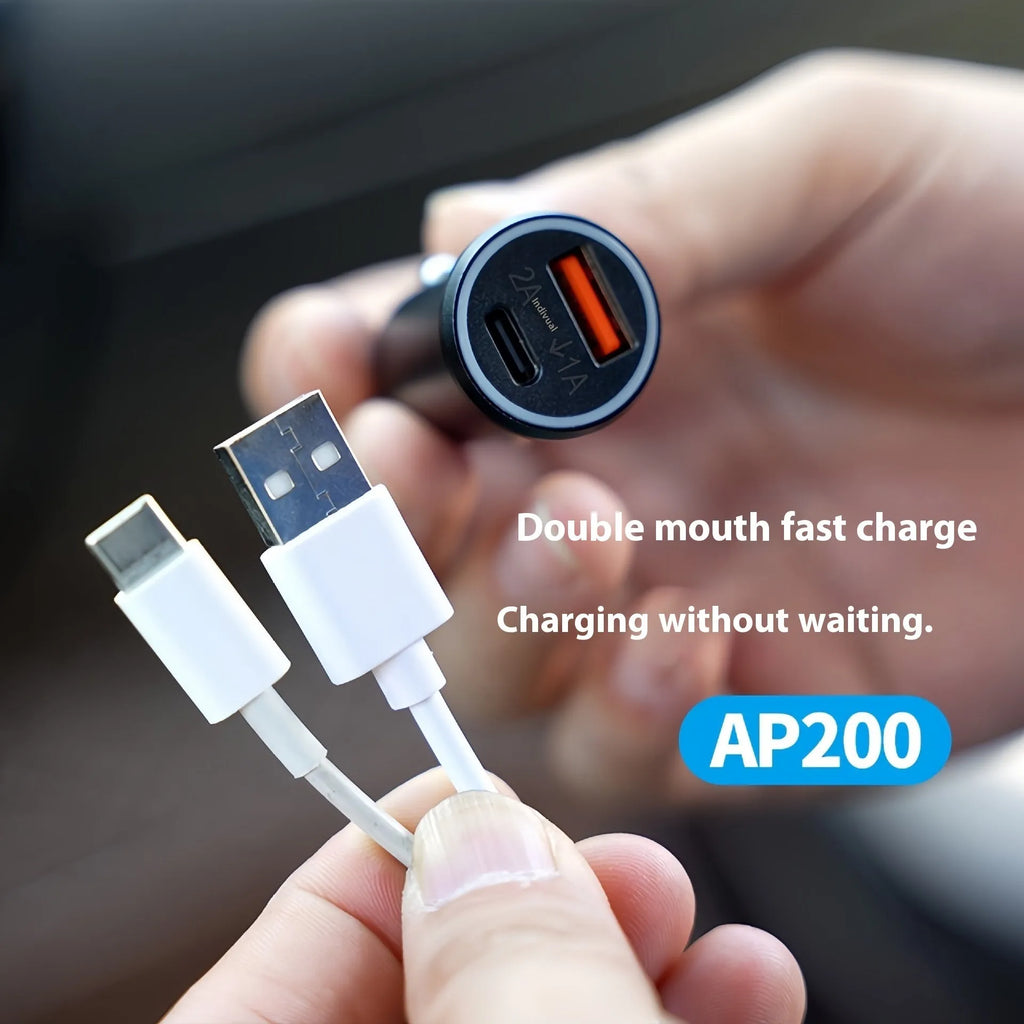 Black GPS car locator tracker with car charger on a table