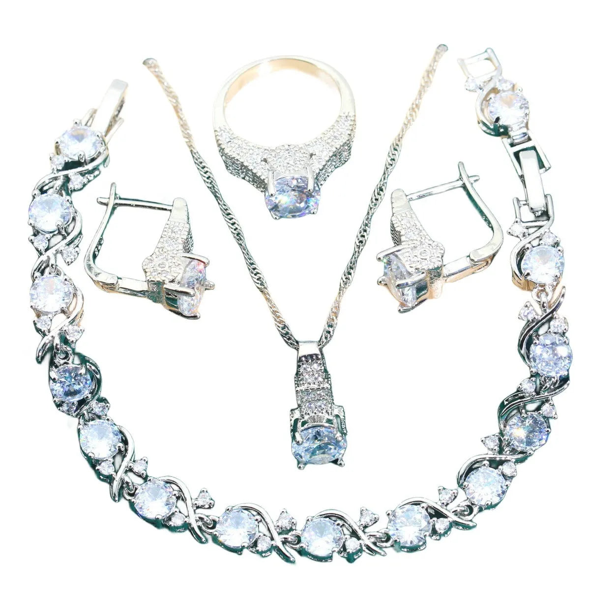 Bridal four-piece jewellery set showing necklace, earrings, ring and bracelet with water wave chain design